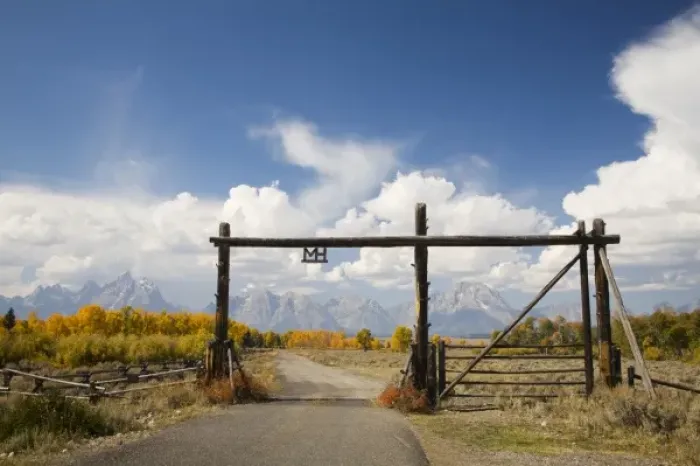 Framed Print : WY, Grand Teton National Park, Teton Range and Cottonwood trees with ranch gateway Framed Print : WY, Grand Teton National Park, Teton Range and Cottonwood trees with ranch gateway