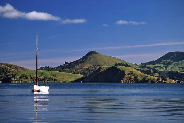 Yacht, Dowling Bay, Otago Harbour. Harbour Cone and Otago Peninsula in background