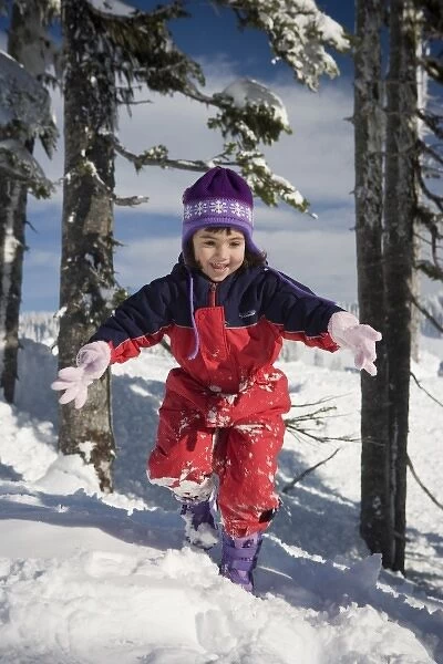 Four year old girl playing in the snow at Mt. Rainier National Park, Washington (MR)