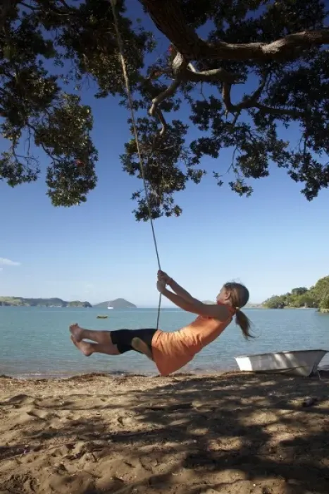 Framed Print : Young Girl on Rope Swing under Pohutukawa Tree, Oamaru Bay, Coromandel, North Island Framed Print : Young Girl on Rope Swing under Pohutukawa Tree, Oamaru Bay, Coromandel, North Island