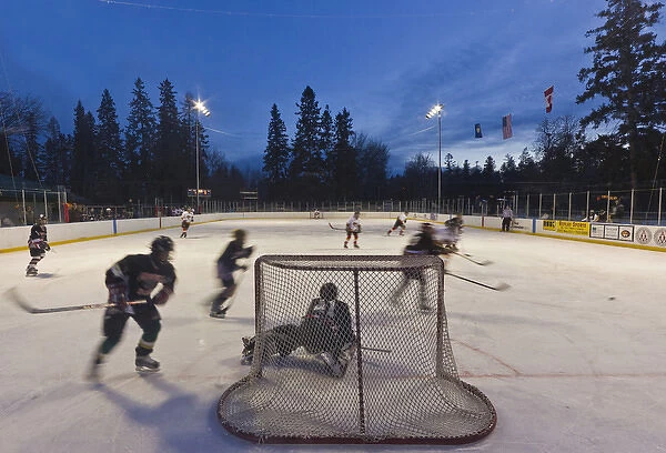 Youth hockey action at Woodland Park in Kalispell, Montana, USA