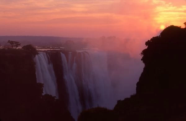Zimbabwe, Victoria Falls National Park. Misty sunrise