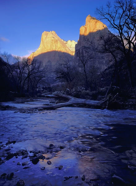 Zion National Park, Utah. USA. Light of sunrise on towers of Zion Canyon above Virgin