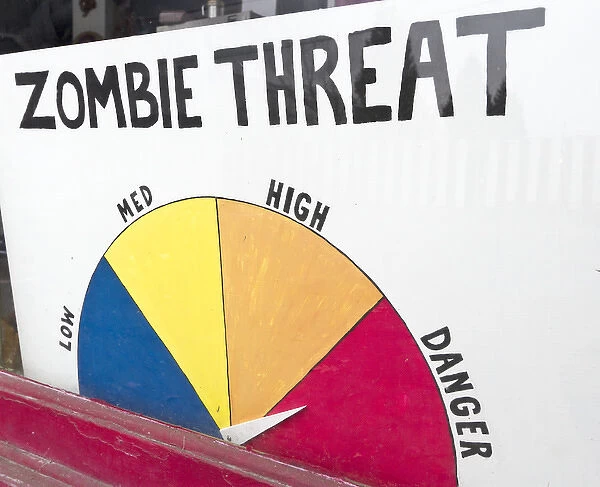 Zombie Threat sign in toy store window, Portland, Oregon