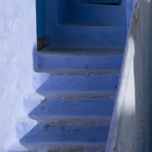 Africa, Morocco, Chefchaouen. Steps leading up into a home