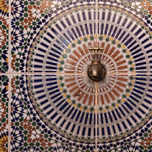 Africa, Morocco. Close-up of tile design patterns around faucet