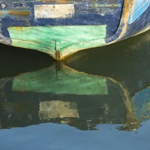 Africa, Morocco, Essouira. An artistic watercolor effect of a wooden boat floating