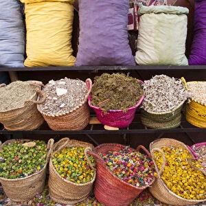Africa, Morocco, Marrakech. A colorful display of potpourri and herbs for sale at a shop
