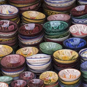 Africa, Morocco, Marrakech. Colorfully painted ceramic bowls for sale in a souk, a shop