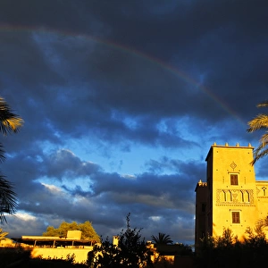 Africa, Morocco, Skoura. Rainbow over Dar Ahlam, a Relais et Chateaux property in Skoura
