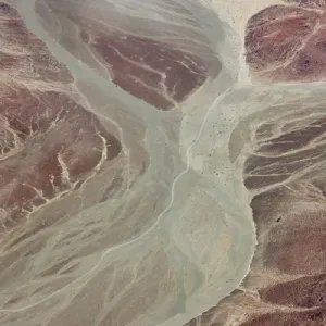 Africa, Namibia, Damaraland. Aerial view of dry river beds running through red rock Africa, Namibia, Damaraland. Aerial view of dry river beds running through red rock
