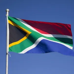 Africa, South Africa, Namaqua National Park. South African flag billows in breeze Africa, South Africa, Namaqua National Park. South African flag billows in breeze