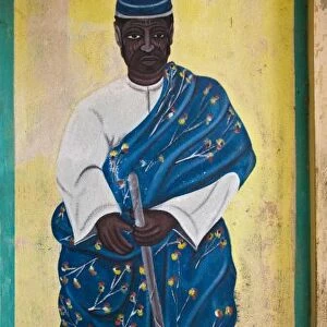 Africa, West Africa, Benin, Ouidah, Temple of the Pythons. Wall mural of man with