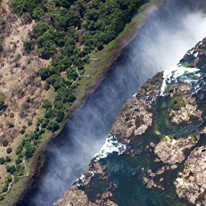 Africa, Zimbabwe, Victoria Falls. Victoria Falls forming the border between Zambia and Zimbabwe