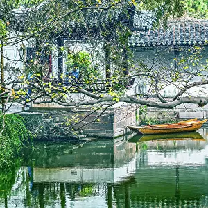 Ancient Chinese pagoda reflection. Humble Administrator's Garden, Jiangsu, China. Garden built in the 1500's, UNESCO site