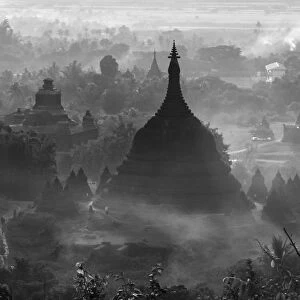 Ancient temples and pagodas in the jungle rising above sunset mist, Mrauk-U, Rakhine State