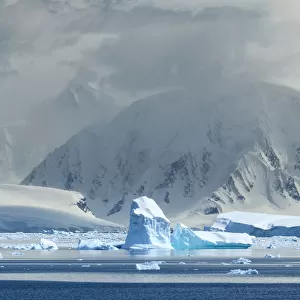 Antarctica, Antarctic Peninsula, Andvord Bay. Iceberg and mountain landscape