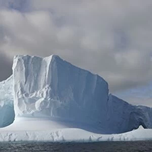 Antarctica, Bransfield Strait, Afternoon sun lights massive tabular iceberg near