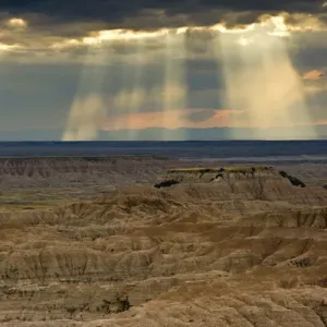 approaching storm and crepuscular rays, sunset, Pinnacles Viewpoint, Badlands National Park
