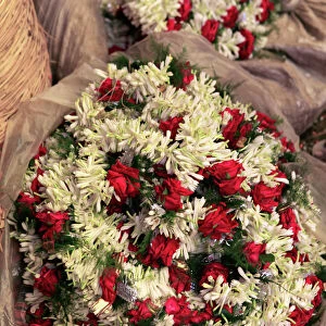 Asia, India, Calcutta. Garlands of rose and freesia in the flower market in Calcutta