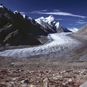 Asia, India, Ladakh, Pensila. Pensila Glacier cuts a cold, white swath through the Zanskar Valley