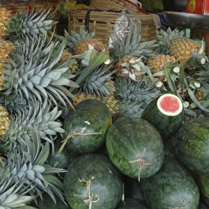 Asia, Vietnam. Watermelons and pineapples for sale at a local market, Can Tho