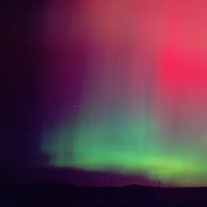 Aurora borealis, northern lights at midnight east of Boise, Idaho following an unusually