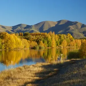 Autumn reflections in Kellands Pond, near Twizel, Mackenzie District, South Canterbury Autumn reflections in Kellands Pond, near Twizel, Mackenzie District, South Canterbury
