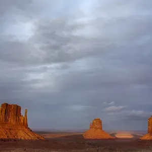 AZ, Monument Valley, West Mitten, East Mitten, and Merrick Butte; sunset AZ, Monument Valley, West Mitten, East Mitten, and Merrick Butte; sunset