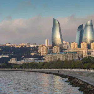 Azerbaijan, Baku. City skyline with Baku Television Tower and Flame Towers from Baku Bay