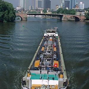 A barge traveling on the Main River in Frankfurt, Germany. germany, german