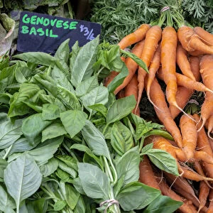 Basil and carrots at farmers market, USA