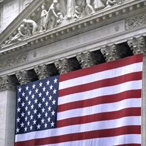 The beauty of the front of the New York Stock Exchange NYSE building with giant USA