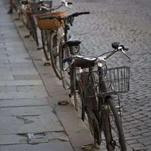 Bicycles parked at curb, Ferrara, Emilia Romagne, Italy