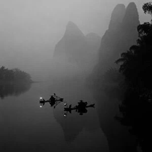 Black and white, China, Li River, Fisherman on Rafts fishing with Cormorants