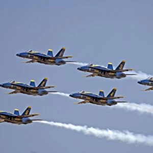 Blue Angles F / A 18 C / D Hornets flying formation at Oshkosh, Wisconsin
