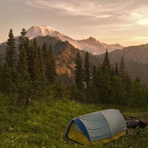 Blue backpacking tent in the Tatoosh Wilderness with a view of snow covered Mt. Rainier