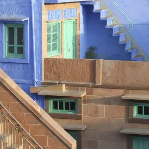 Blue City, Jodhpur, India. Blue apartment with a teal, green door, and painted flower pots Blue City, Jodhpur, India. Blue apartment with a teal, green door, and painted flower pots