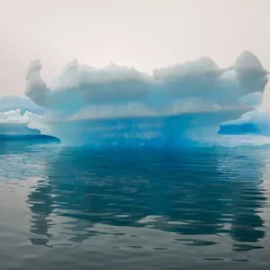 Blue iceberg in the fjord of Narsarsuaq, Greenland Blue iceberg in the fjord of Narsarsuaq, Greenland