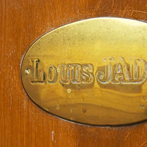 The brass plate on the entrance door of Maison Louis Jadot. Maison Louis Jadot