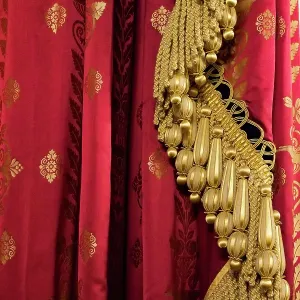 Brighton, England, United Kingdom. Red and gold fabric and tassels Brighton, England, United Kingdom. Red and gold fabric and tassels