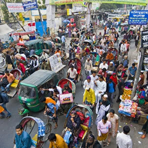 Very busy Rickshaw traffic on a street crossing in Dhaka, Bangladesh, Asia