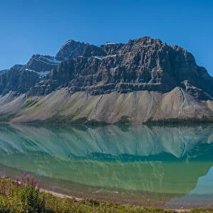 Canada, Alberta. Panoramic view of the still blue waters of Bow Lake on the Icefields