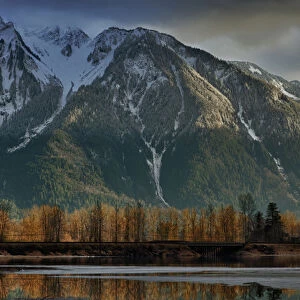 Canada, British Columbia, Agassiz, Seabird Island Road, storm clearing over mountains at sunset