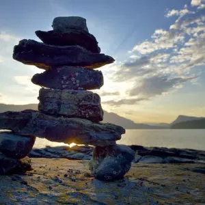 Canada, British Columbia, Russell Island. Rock inukshuk in front of Salt Spring Island Canada, British Columbia, Russell Island. Rock inukshuk in front of Salt Spring Island