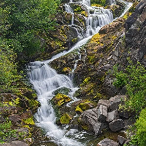 Canada, New Brunswick. River waterfall and rocky rapids