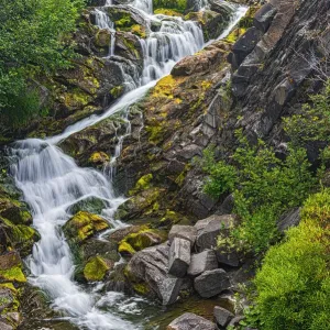 Canada, New Brunswick. River waterfall and rocky rapids