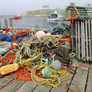 Canada, Nova Scotia, Peggys Cove. Fishing gear and harbor