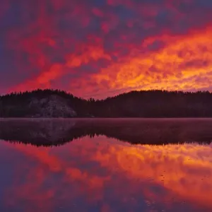 Canada, Ontario, Capreol. Clouds reflected in Vermilion River at sunrise