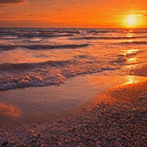 Canada, Ontario, Sandbanks Provincial Park, Waves on Lake Ontario beach at sunset